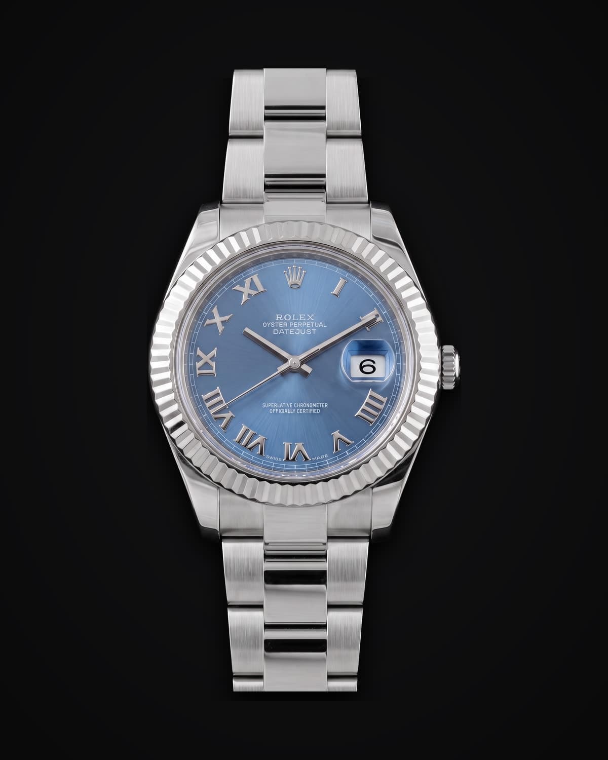 Steel watch with a blue dial and fluted bezel on a steel bracelet