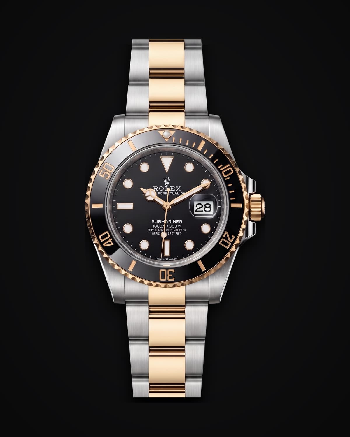 Two-tone steel and gold dive watch with a black dial