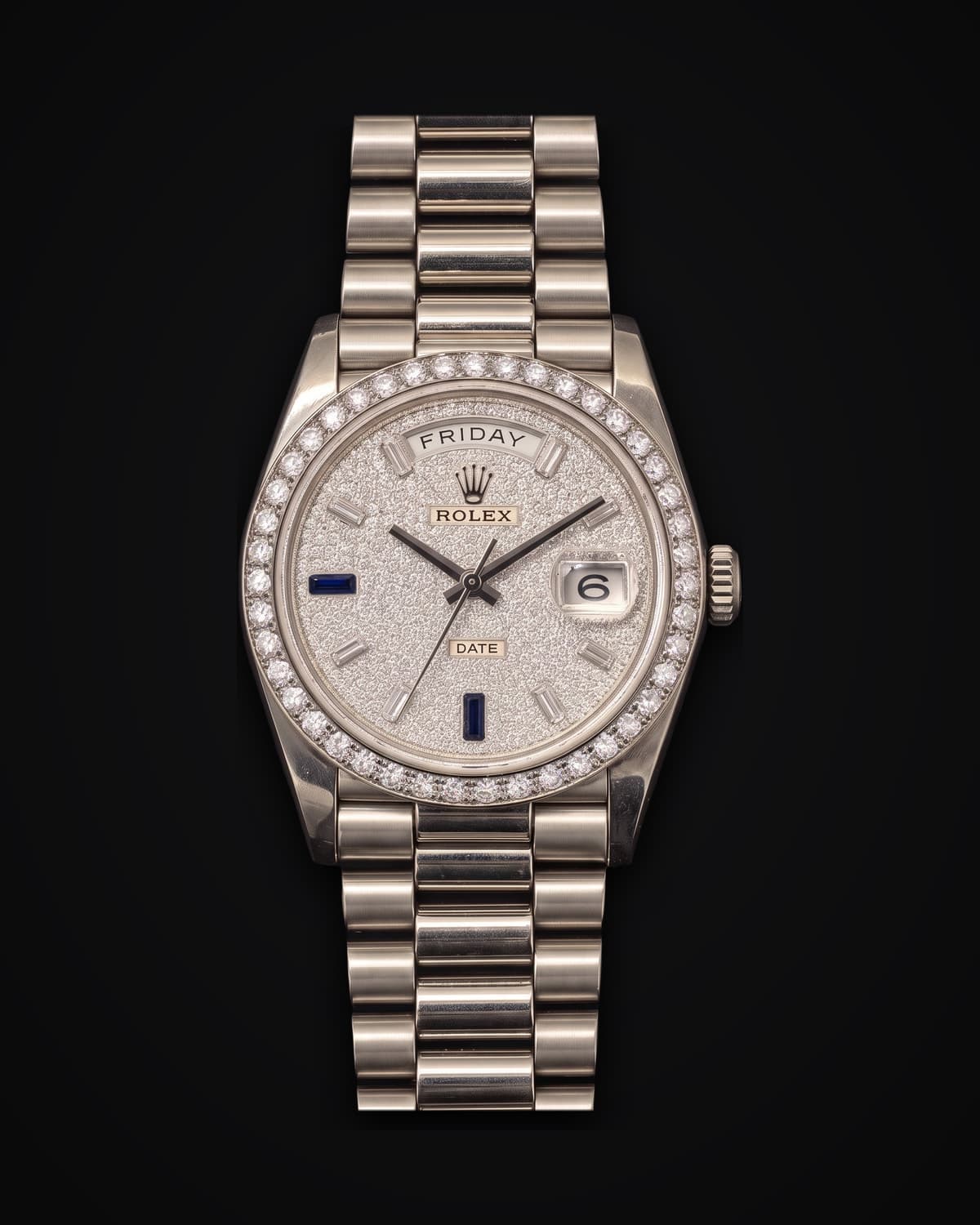 White-metal watch with a stone-set dial and bezel, a day window and a President bracelet